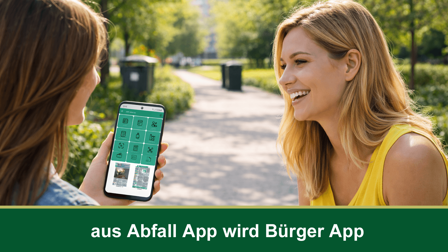 Zwei weiblich gelesenen Personen halten ein Handy mit der App des AWV.. © Abfallwirtschaftszweckverband Ostthüringen
