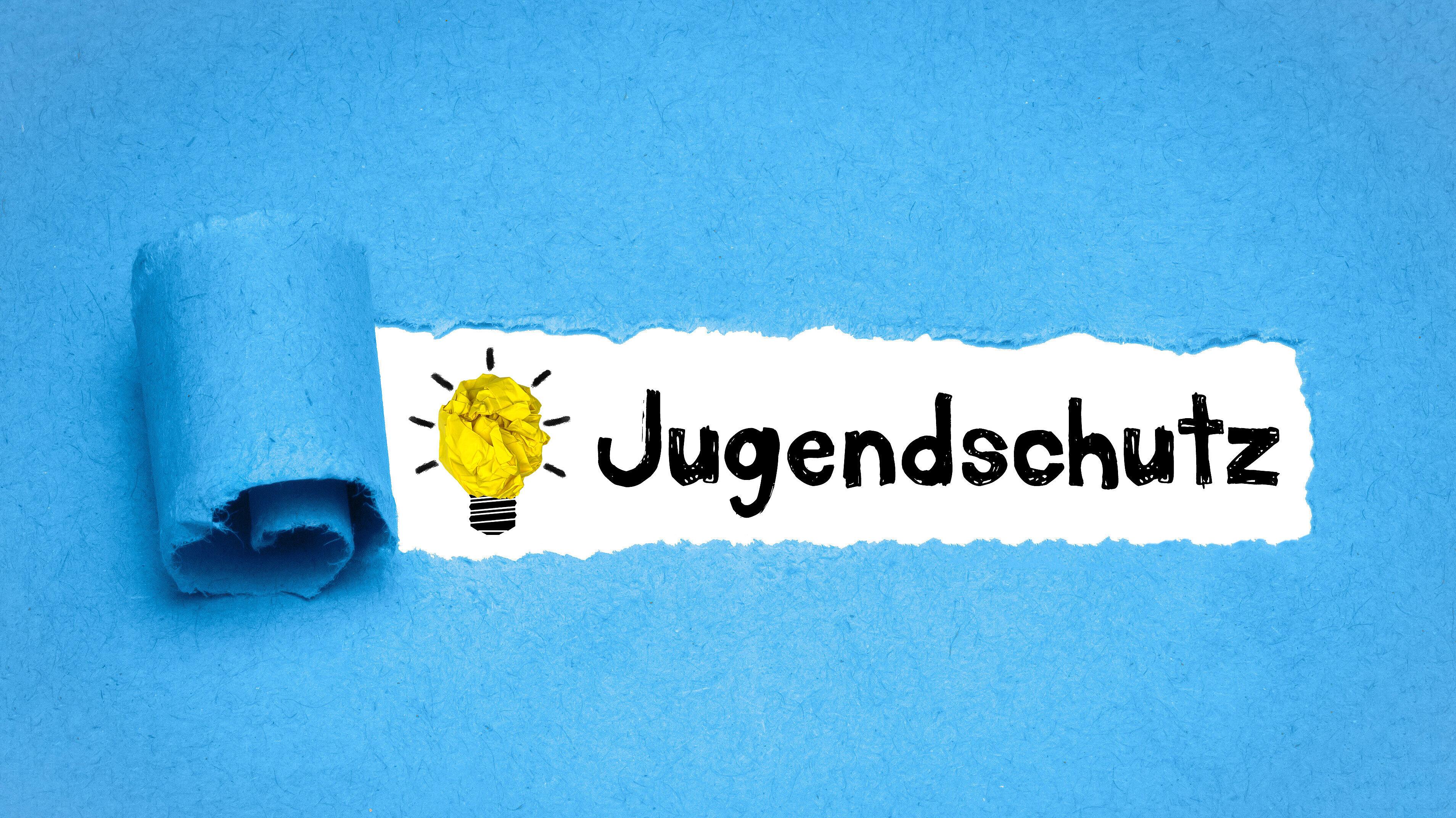 Das Wort "Jugendschutz" auf blauem Hintergrund. © stock.adobe.com