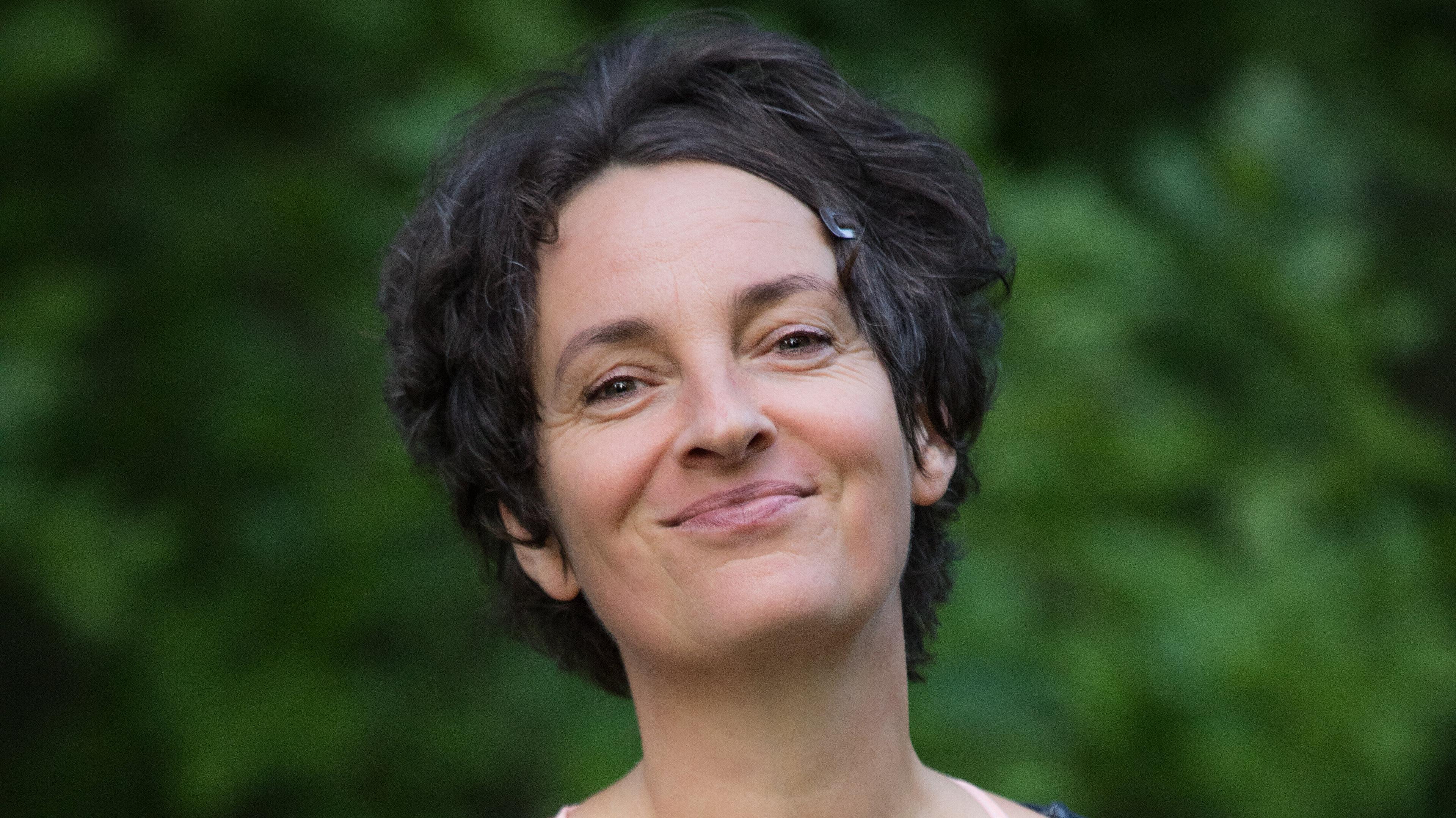 Bild einer Frau welche in die Kamera lächelt. © Tina Peißker